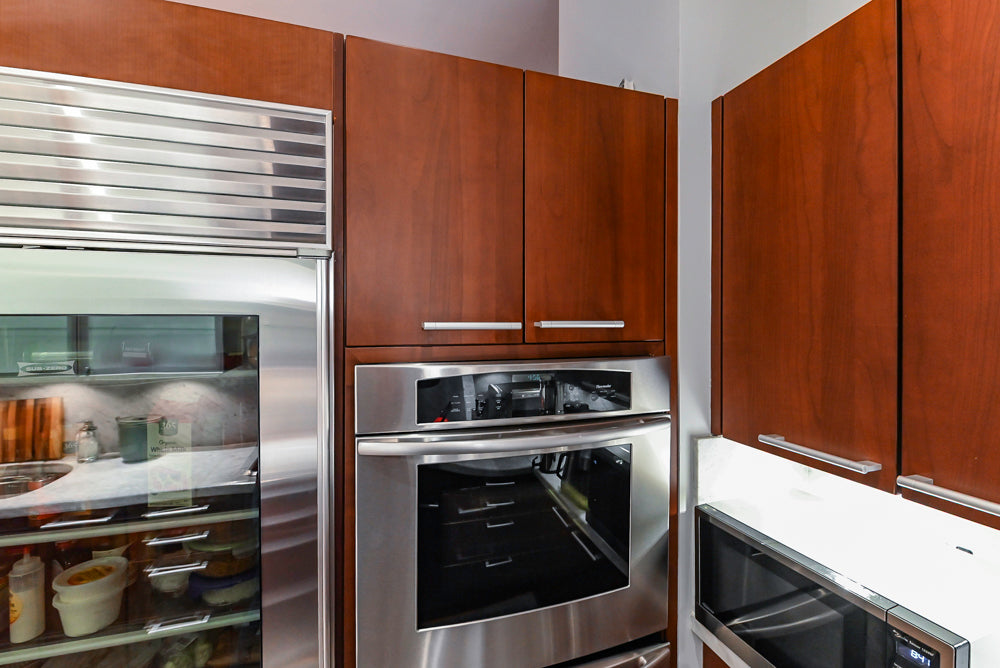 Poggenpohl Brown Toned Transitional Kitchen with Marble Countertops and Appliances