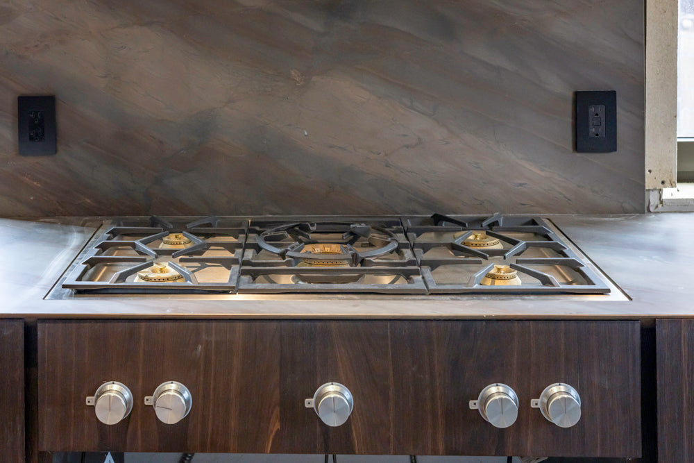 minotticucine Modern Classic Dark Brown Kitchen with Stone Countertops and Gaggenau Refrigerators