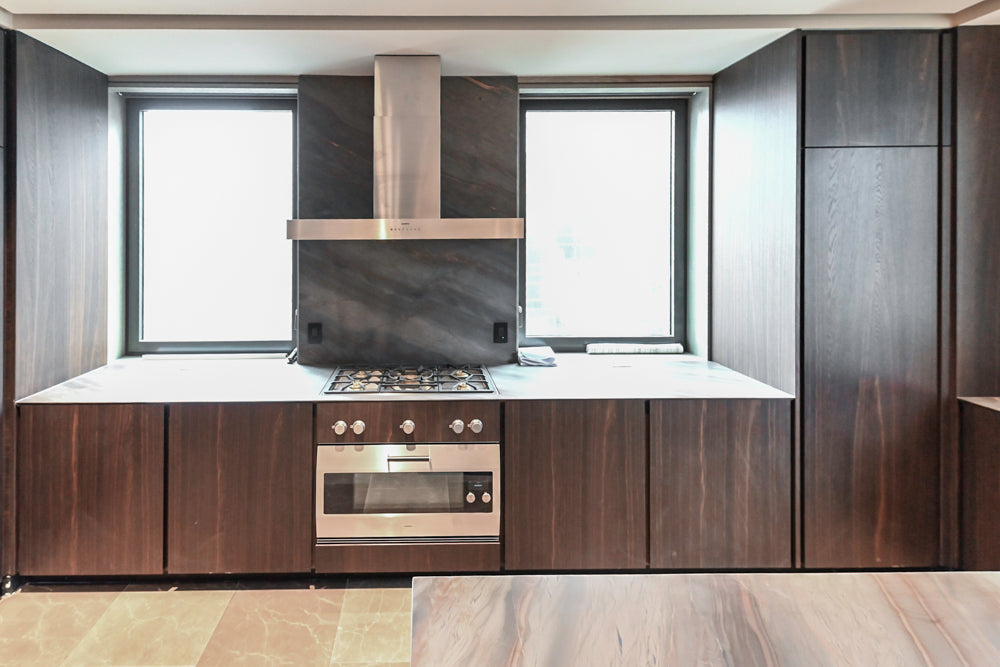 minotticucine Modern Classic Dark Brown Kitchen with Stone Countertops and Gaggenau Refrigerators
