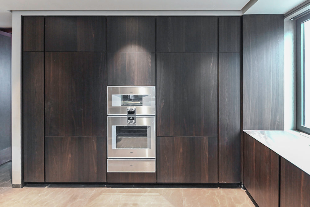 minotticucine Modern Classic Dark Brown Kitchen with Stone Countertops and Gaggenau Refrigerators