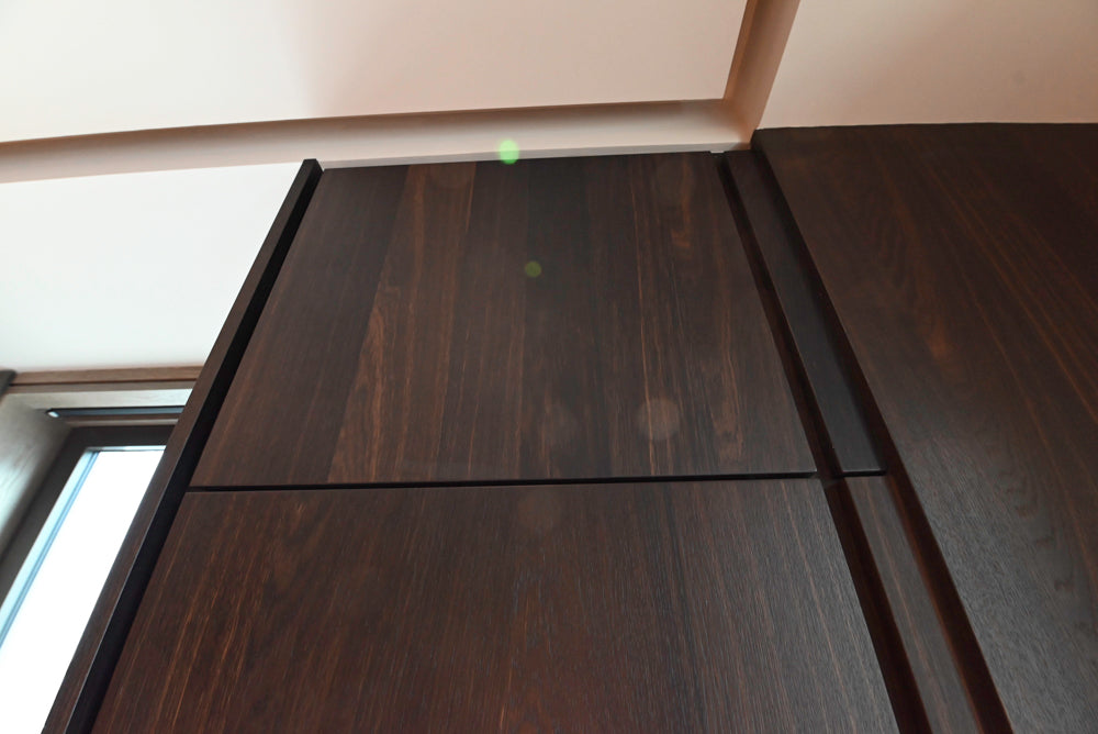 minotticucine Modern Classic Dark Brown Kitchen with Stone Countertops and Gaggenau Refrigerators