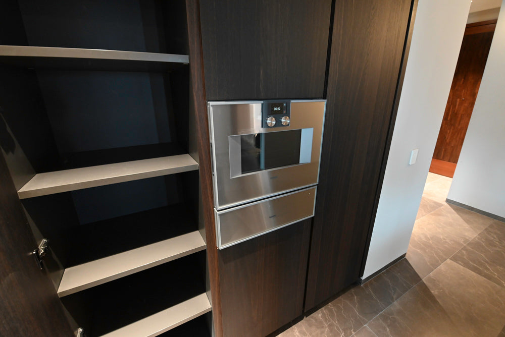 minotticucine Modern Classic Dark Brown Kitchen with Stone Countertops and Gaggenau Refrigerators