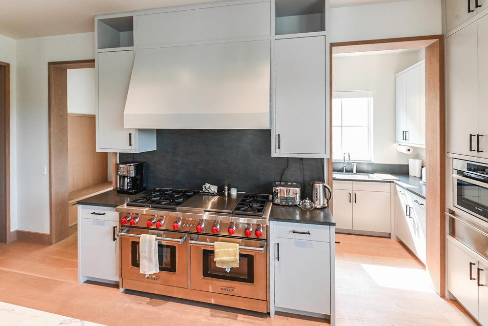 Custom Modern Two-Tone Kitchen with Marble Top Island and Sub-Zero & Wolf Appliances