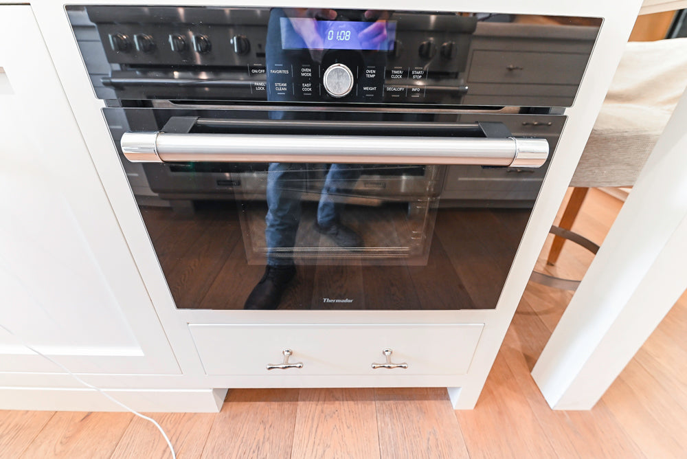 Ciuffo Cabinetry Transitional White Kitchen with Marble Countertops and Thermador Appliances