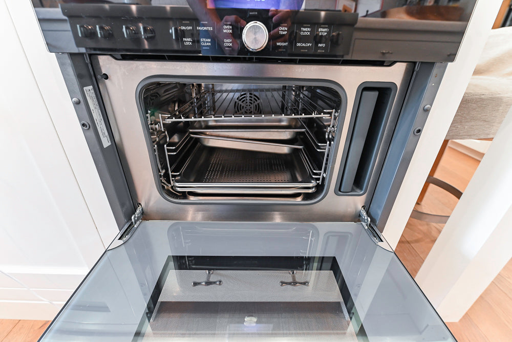 Ciuffo Cabinetry Transitional White Kitchen with Marble Countertops and Thermador Appliances