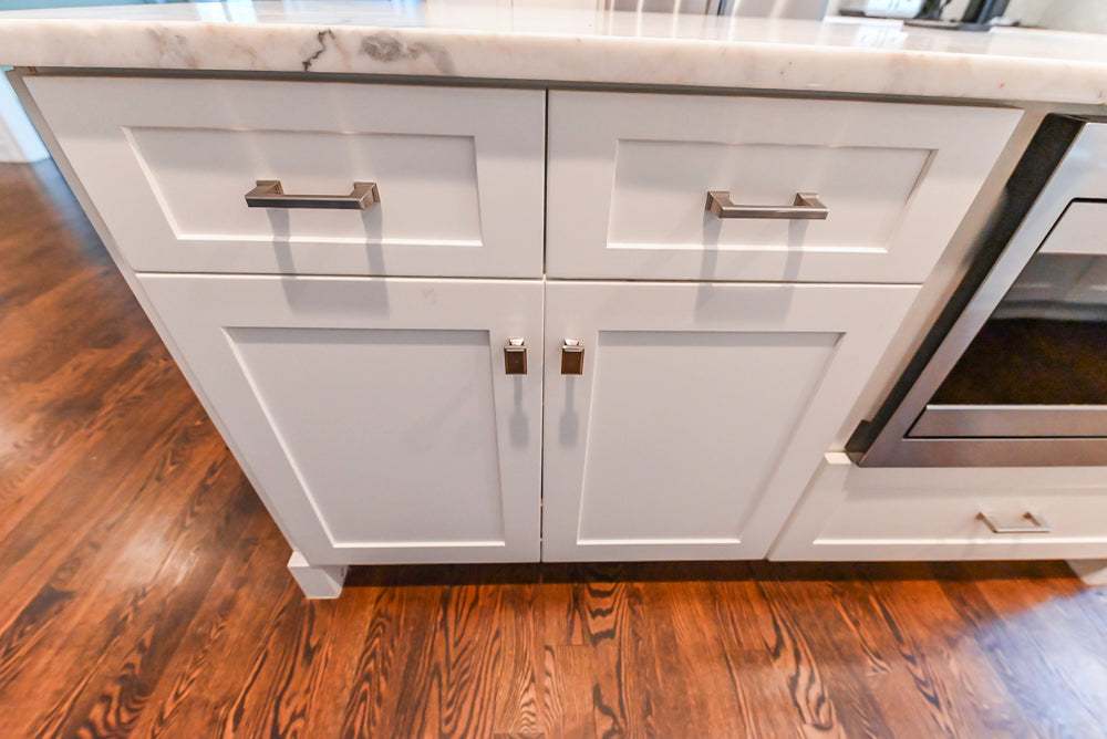 Fabuwood Transitional White Kitchen with Island and White Marble Countertops