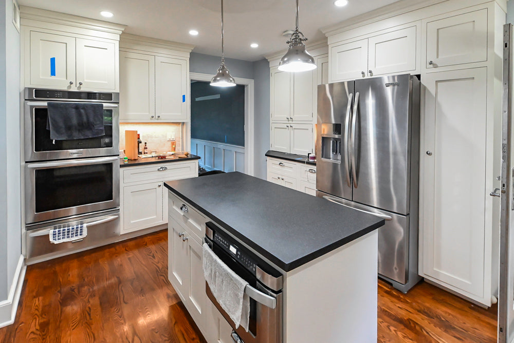 Custom Traditional White Kitchen with Stone Countertops and Appliances