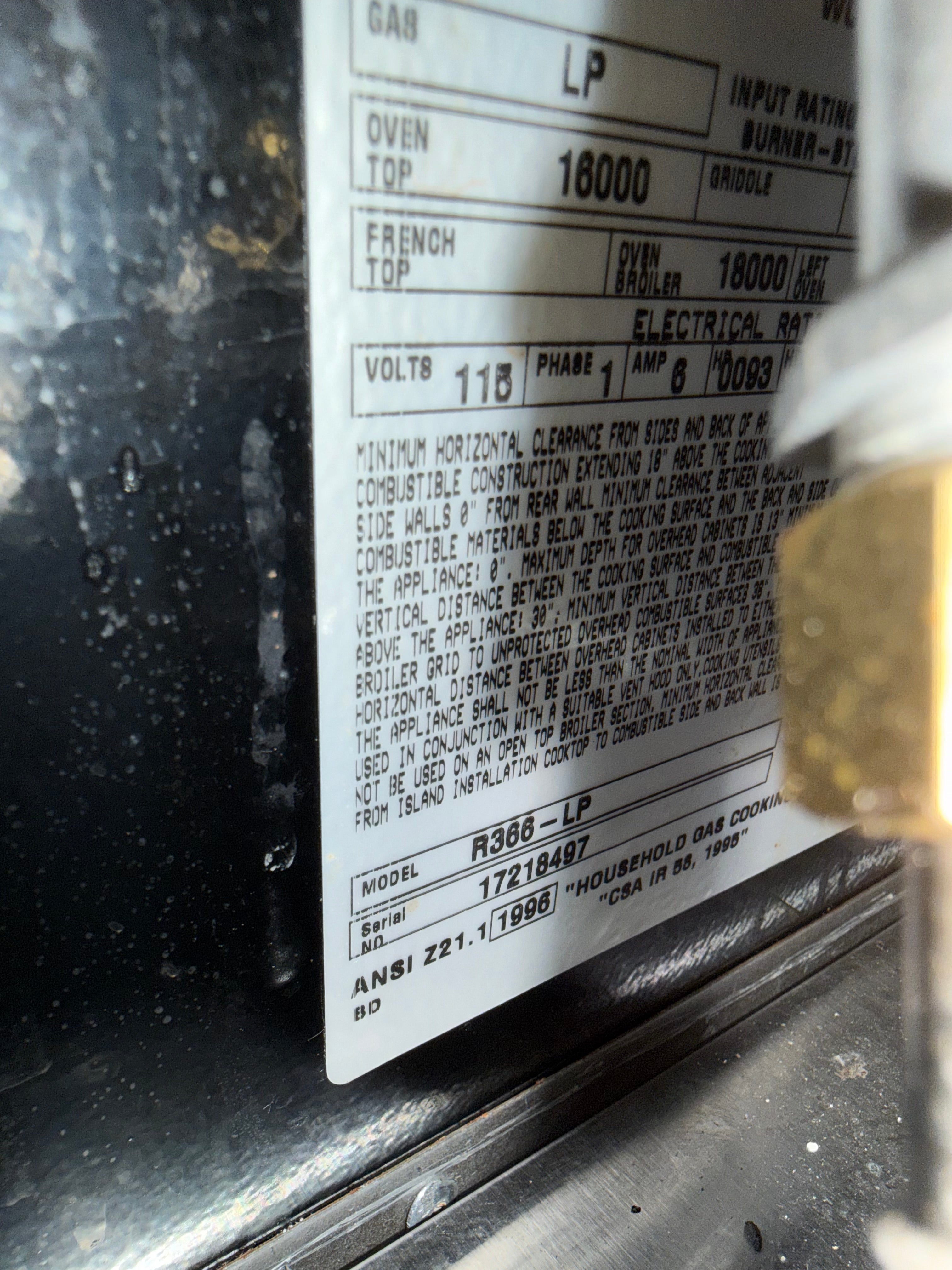 Technical label on a appliance with text and numbers