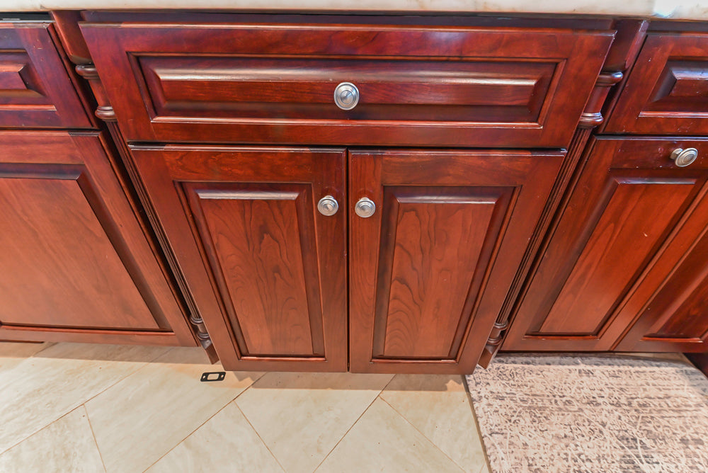 Custom Traditional Dark Wooden Kitchen with Marble Countertops and Wolf Appliances