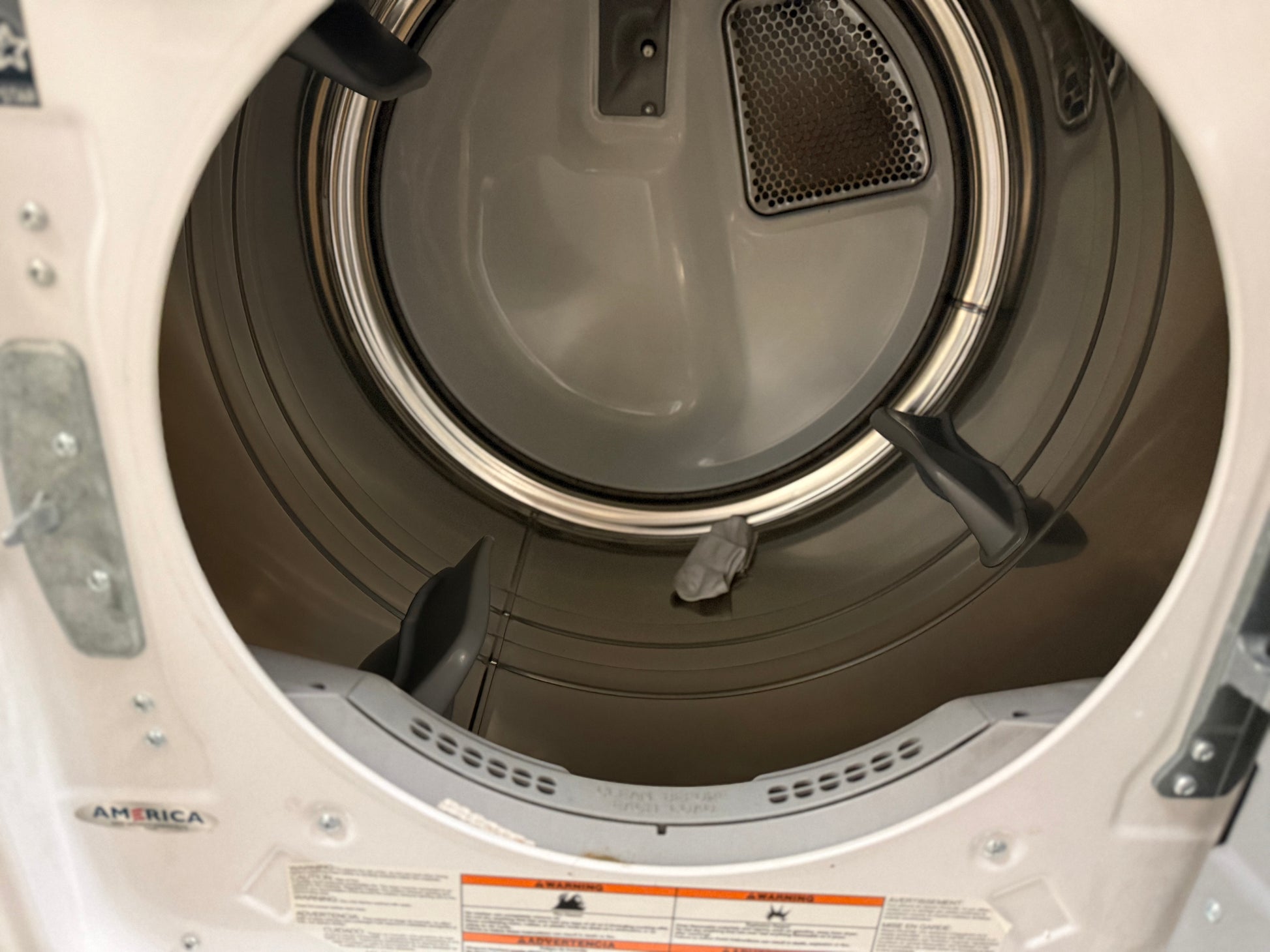 Open dryer drum with visible interior components
