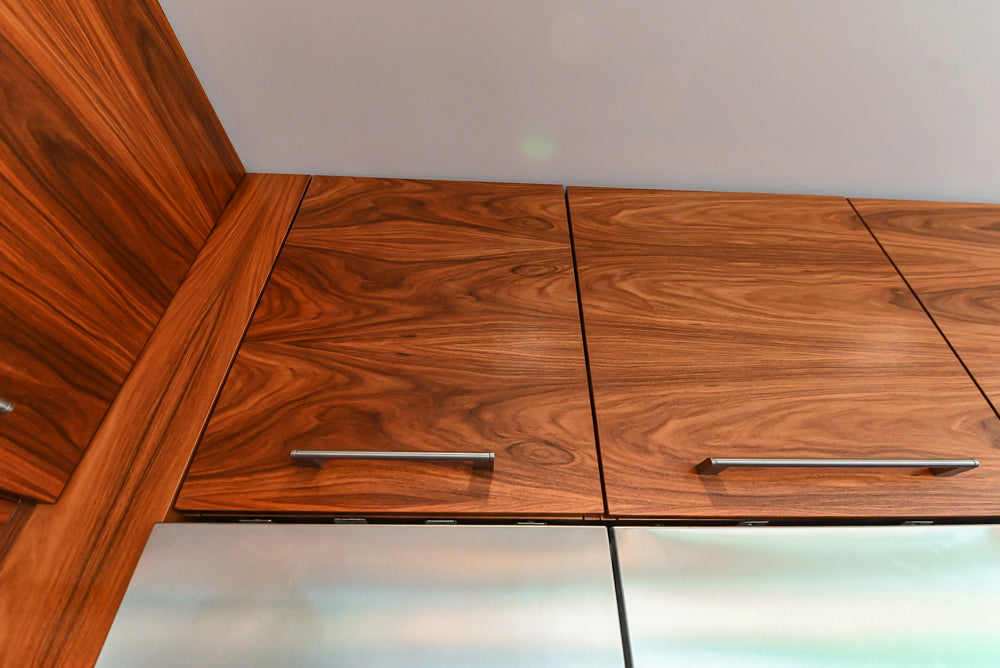 Custom Modern Tigerwood Kitchen with Marble Countertops and Gaggenau Appliances