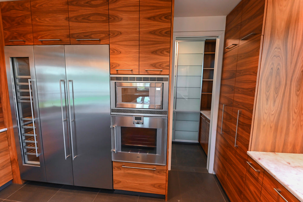 Custom Modern Tigerwood Kitchen with Marble Countertops and Gaggenau Appliances