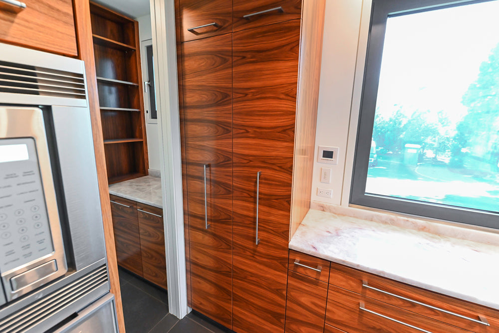 Custom Modern Tigerwood Kitchen with Marble Countertops and Gaggenau Appliances