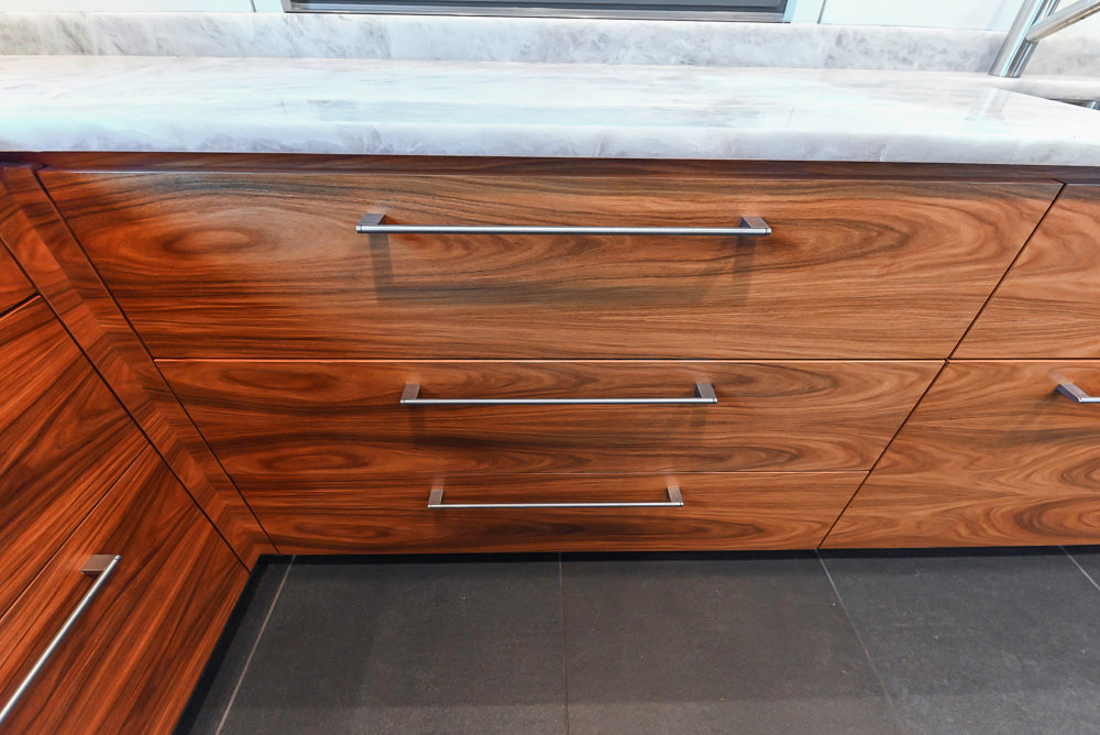 Custom Modern Tigerwood Kitchen with Marble Countertops and Gaggenau Appliances