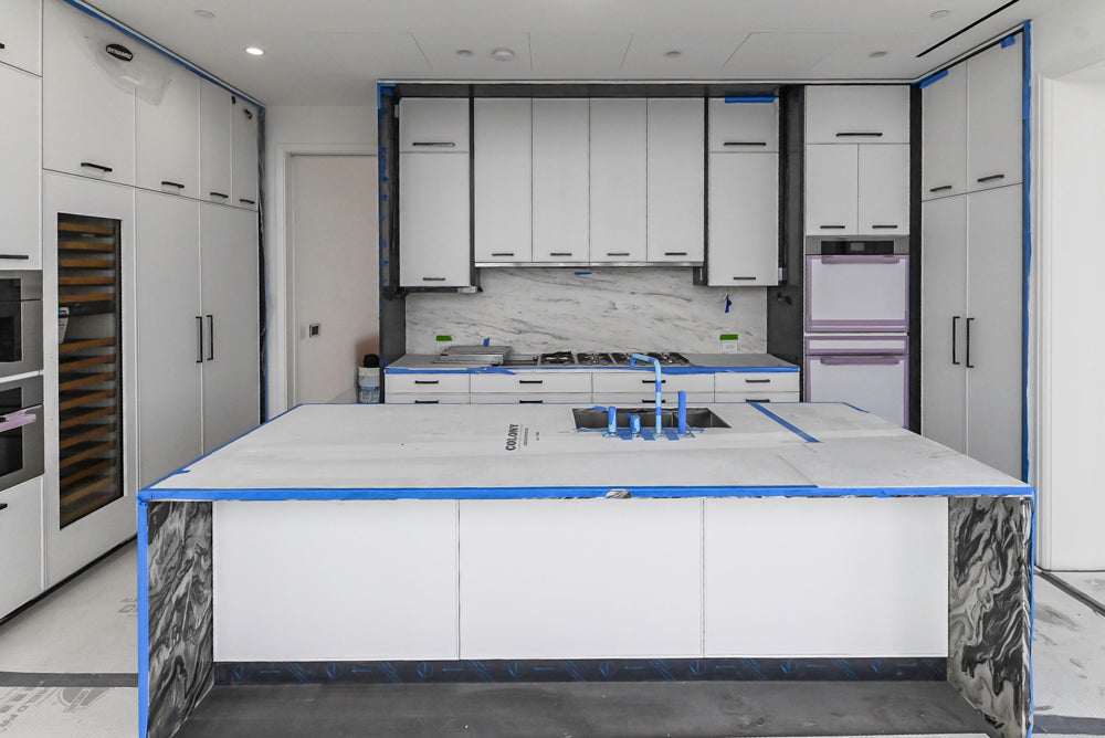 Custom Transitional White Kitchen with Island and Quartzite Countertops 