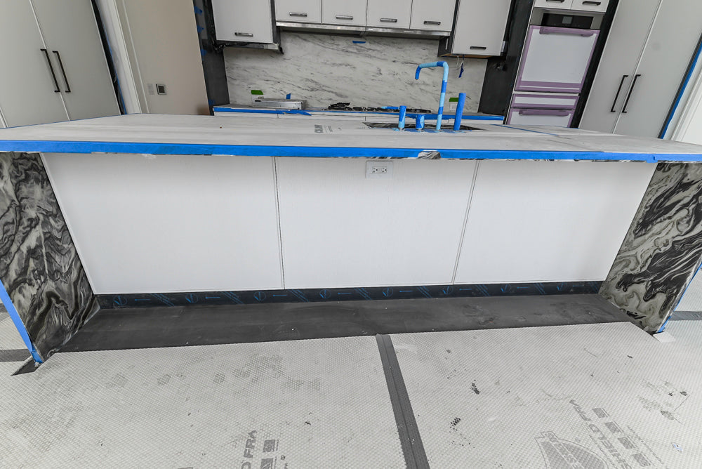 Custom Transitional White Kitchen with Island and Quartzite Countertops 