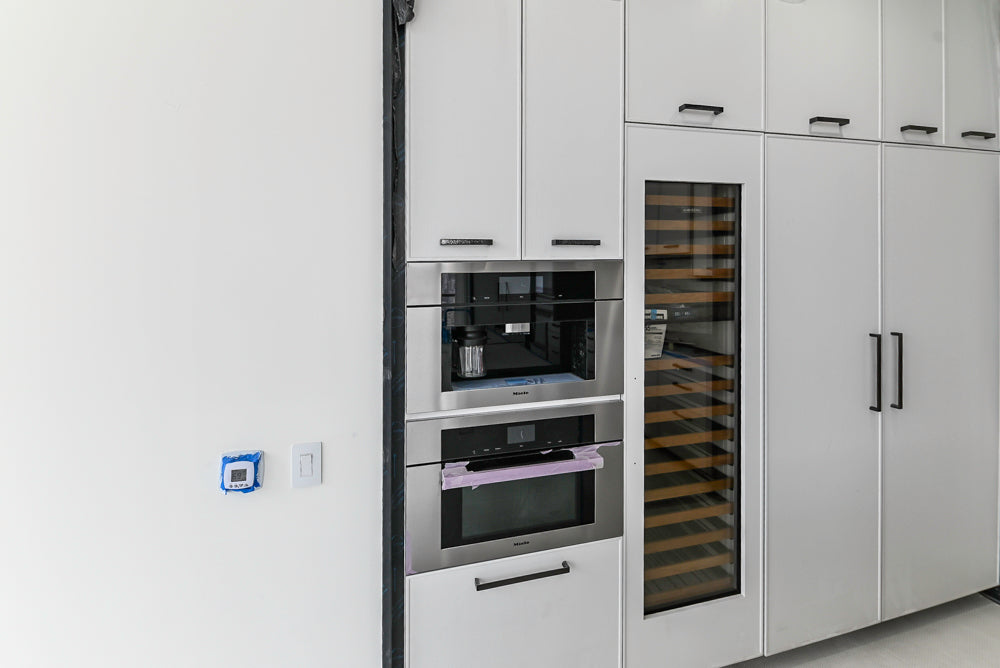 Custom Transitional White Kitchen with Island and Quartzite Countertops 