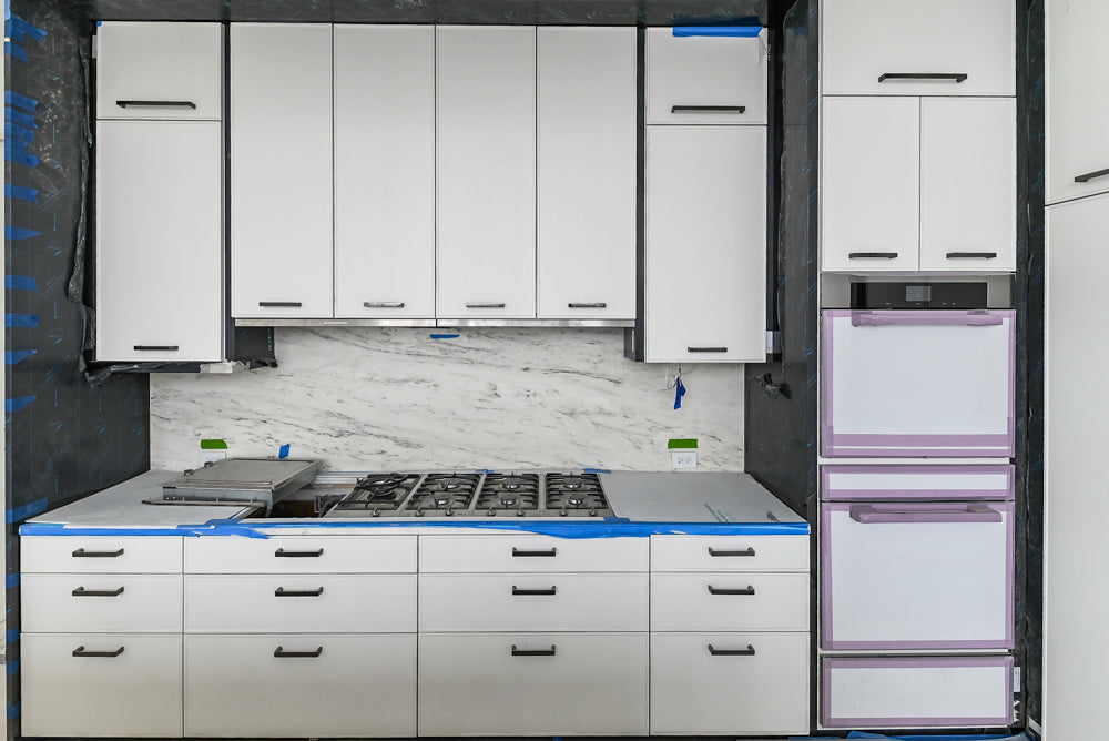 Custom Transitional White Kitchen with Island and Quartzite Countertops 