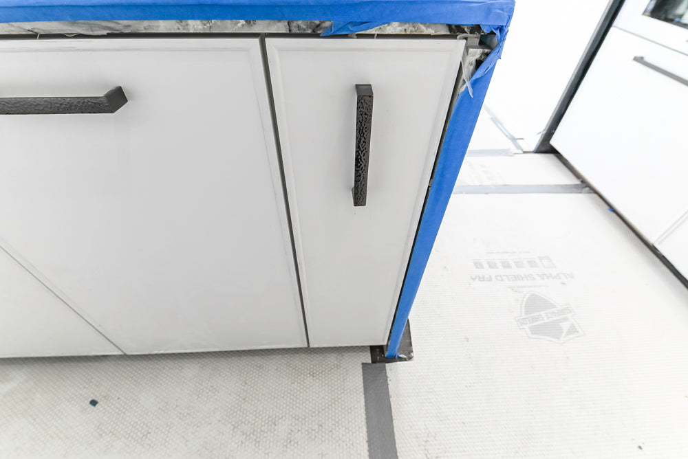 Custom Transitional White Kitchen with Island and Quartzite Countertops