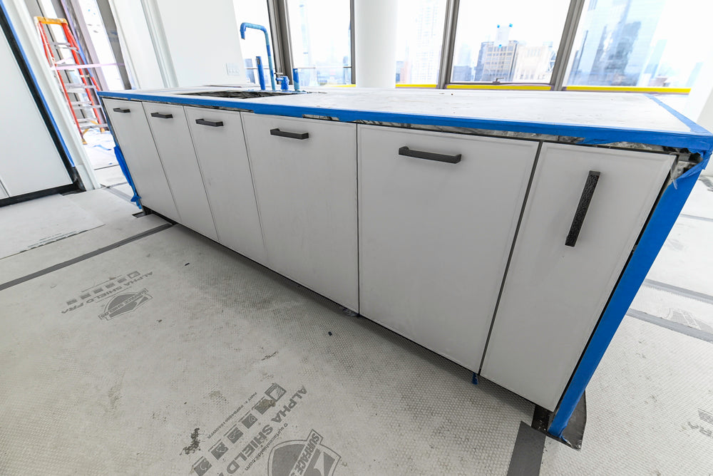 Custom Transitional White Kitchen with Island and Quartzite Countertops 