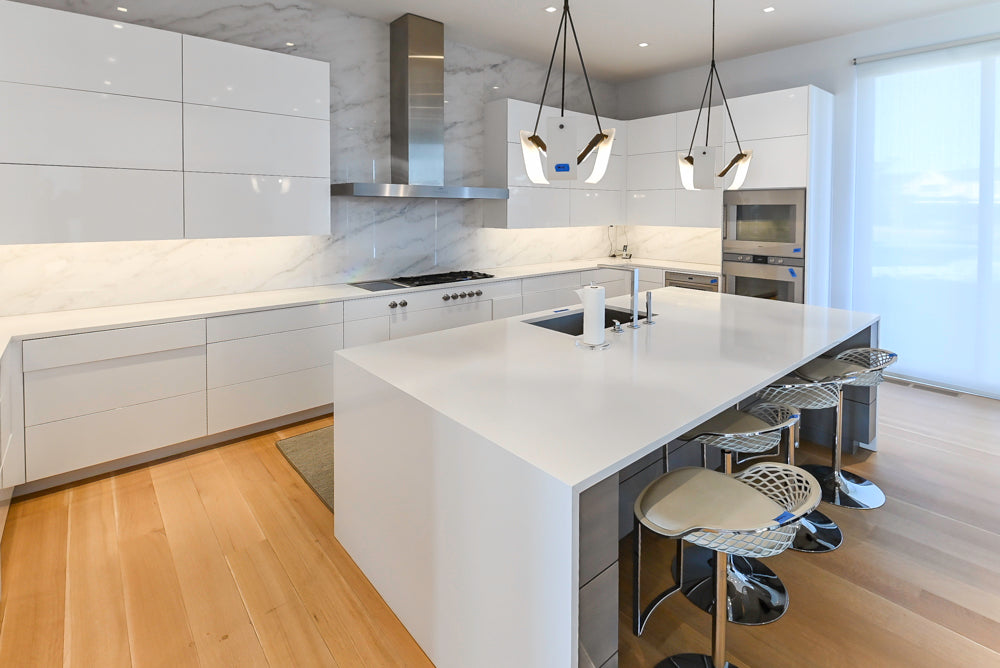 Brubaker Modern White Lacquered Kitchen with Waterfall Island and Stone Countertops