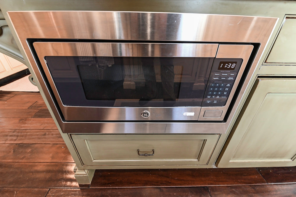 “The Harcourt” Traditional Two-Tone Distressed Kitchen with Green Island, Quartz Countertops and Appliances