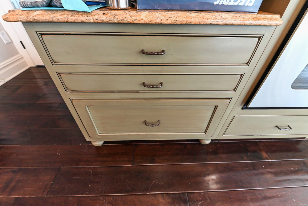 “The Harcourt” Traditional Two-Tone Distressed Kitchen with Green Island, Quartz Countertops and Appliances