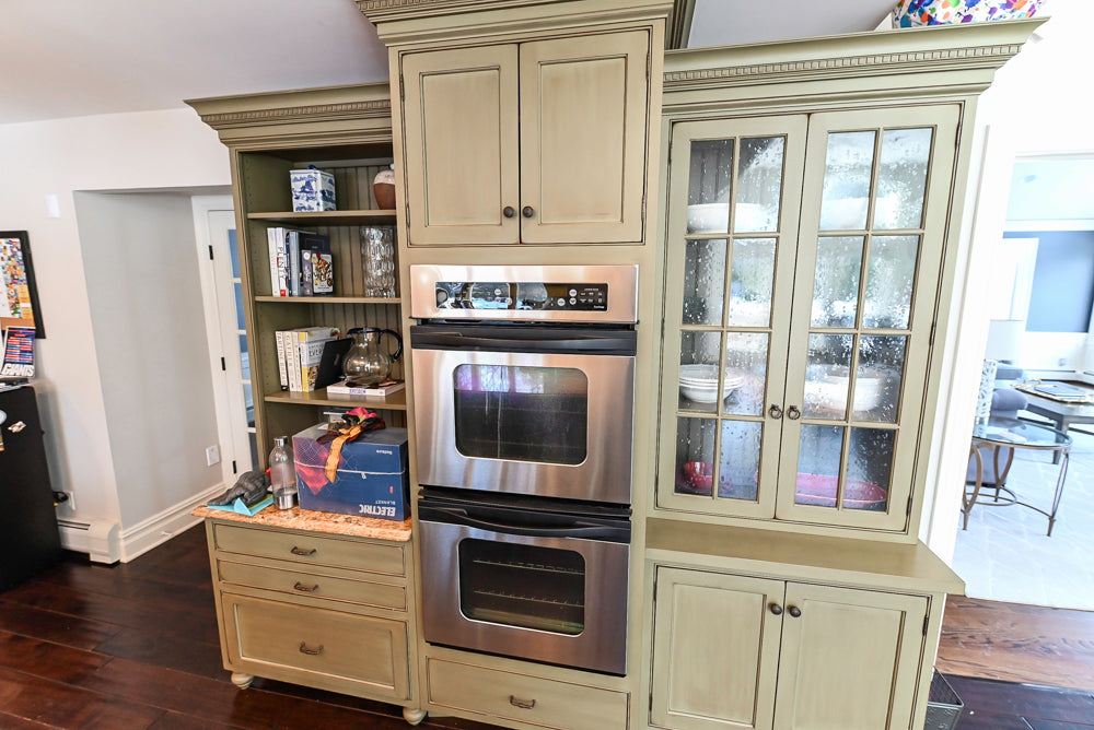“The Harcourt” Traditional Two-Tone Distressed Kitchen with Green Island, Quartz Countertops and Appliances