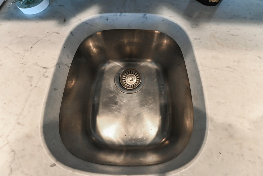 Custom Transitional Dark Grey Butler's Pantry with White Marble Countertops and Sink