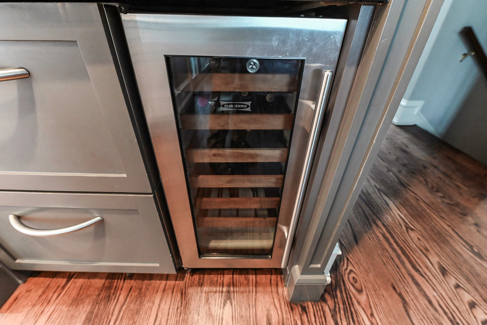 Custom Transitional Dark Grey Dry Bar with Dark Granite Countertops and Sub-Zero Wine Cooler
