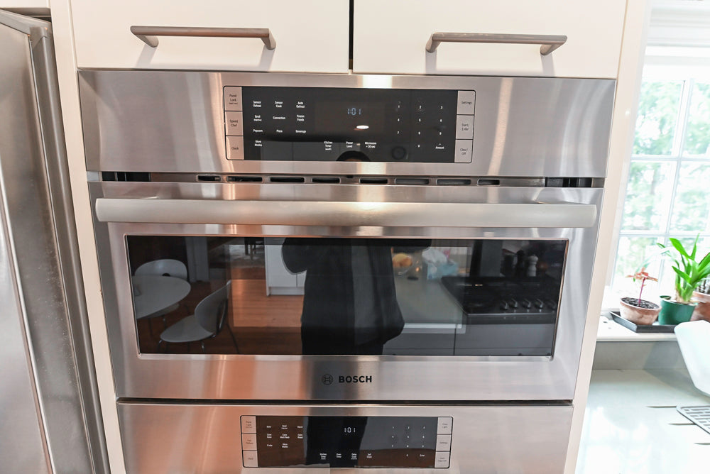 Nobilia Modern White Kitchen with Grey Stone Countertops, Island and Bosch Appliances