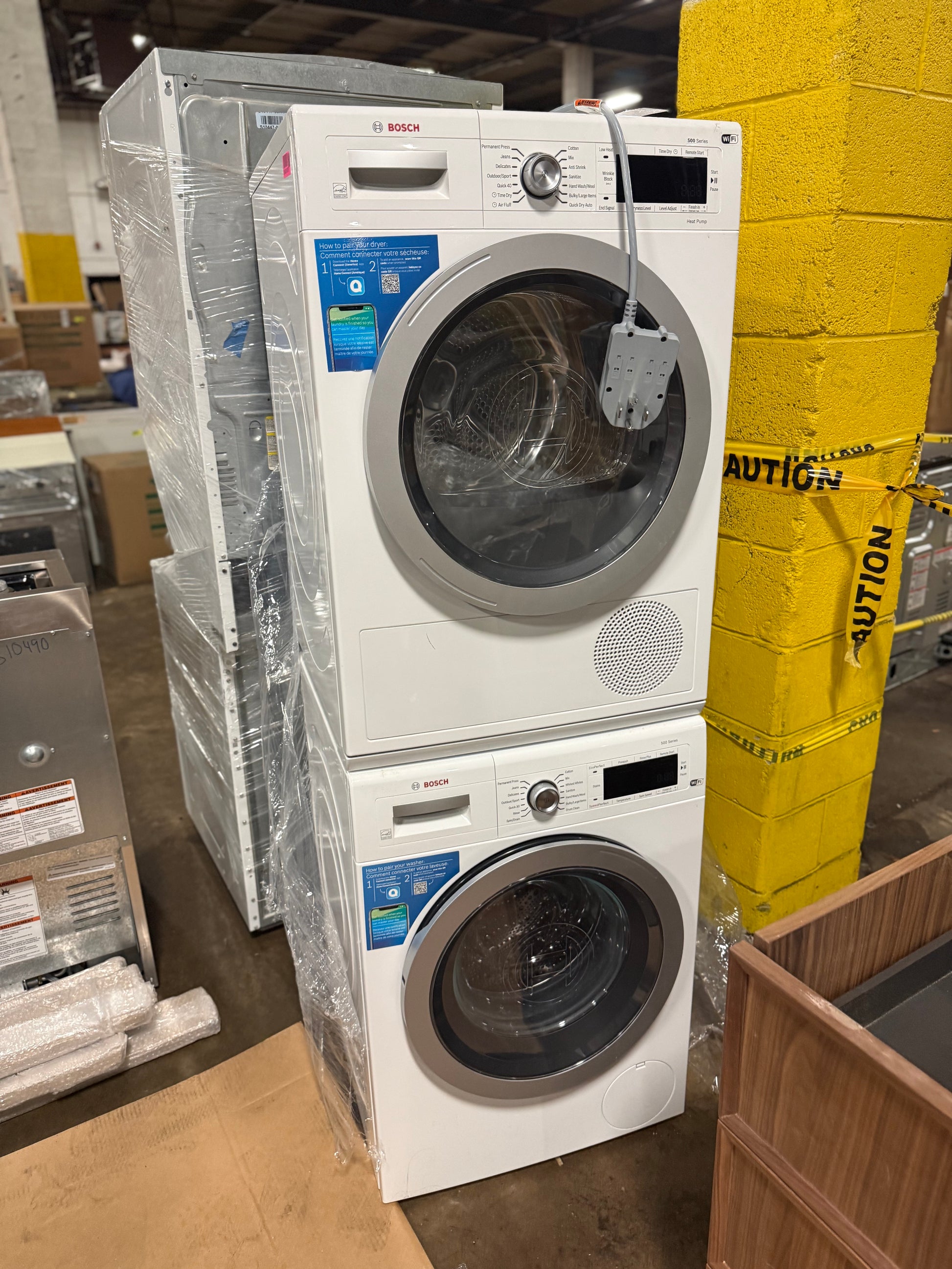 Luxury space saving compact laundry set showing open washer and dryer front load doors