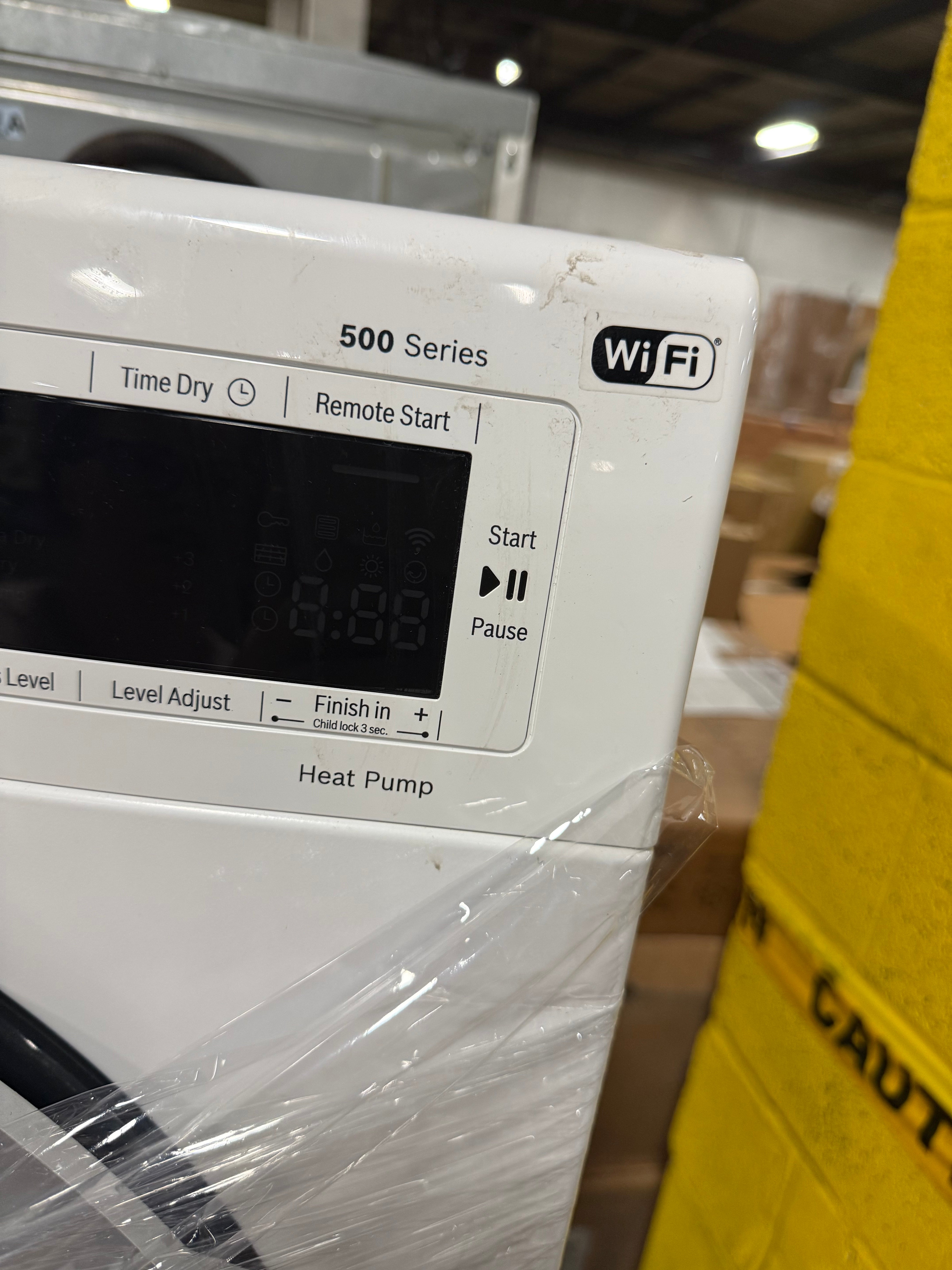 Bosch 500 Series 24" White Stacked Washer & Electric Dryer