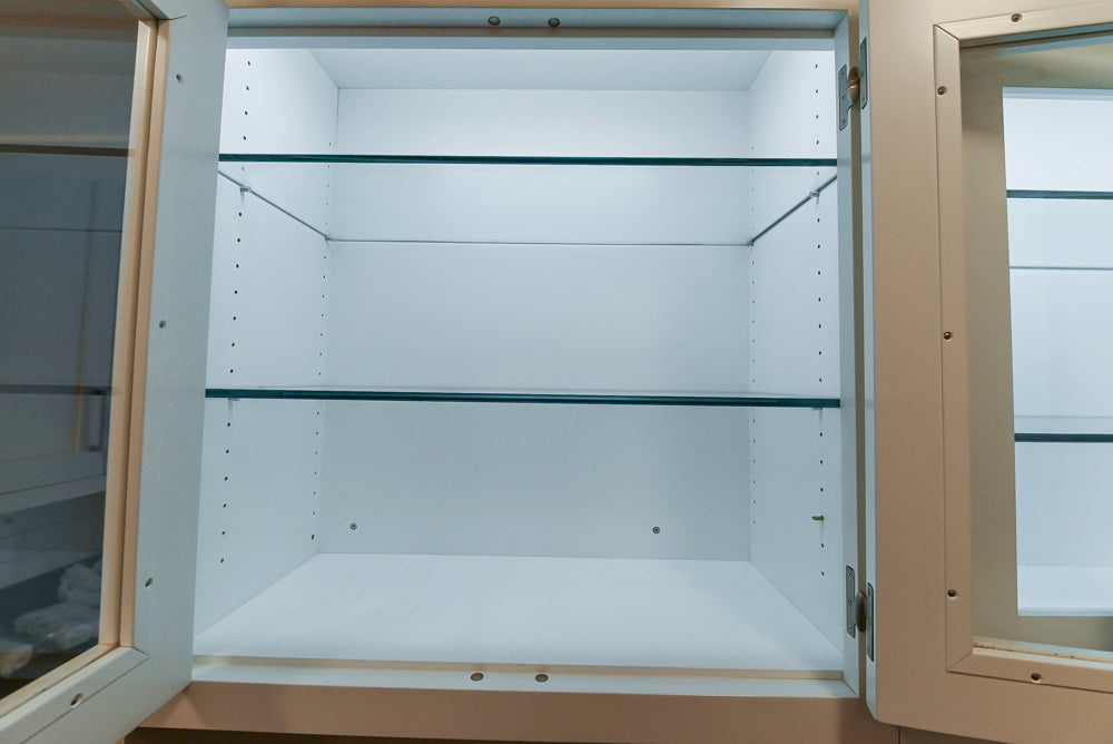 Empty white cabinet with glass doors