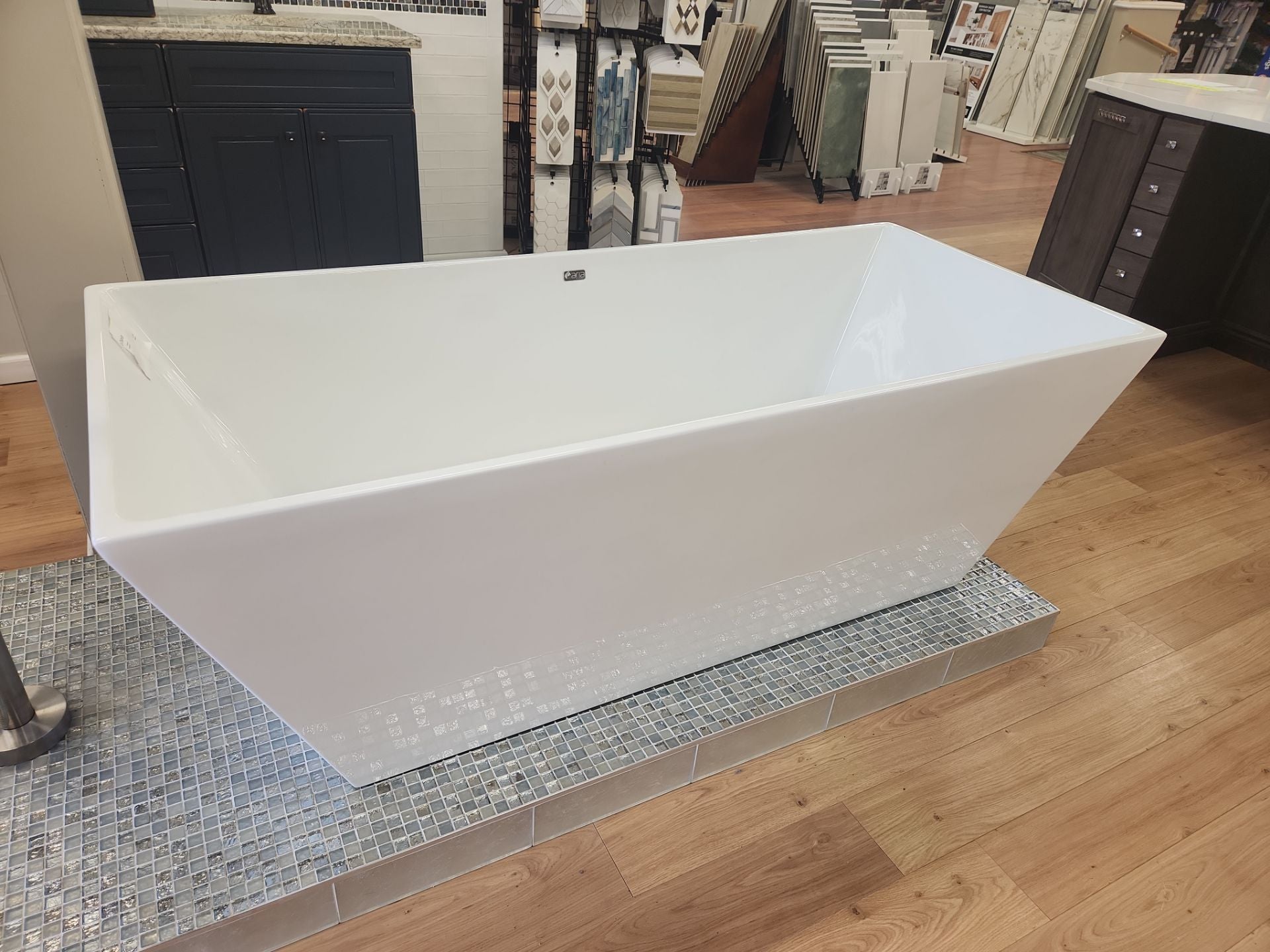 Fleurco Calando Grande freestanding bathtub with Delta floor-mounted tub filler