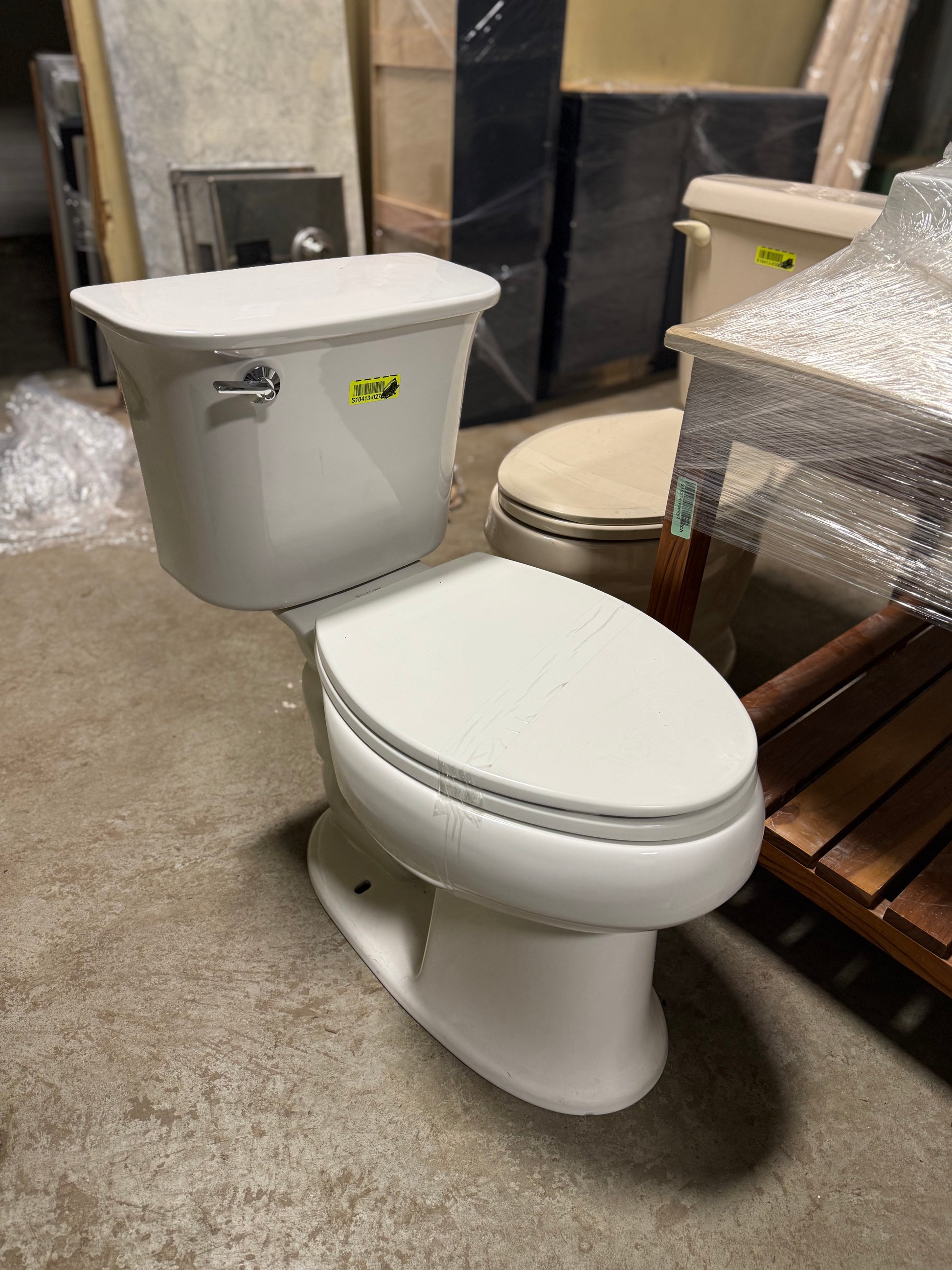 Modern two-piece white ceramic toilet for guest or primary bathroom