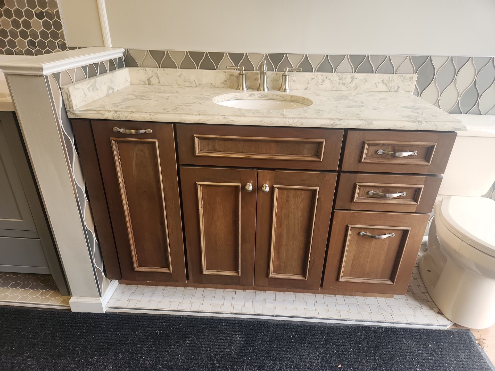 Merillat 55 inch traditional wood freestanding vanity with stone top and sink