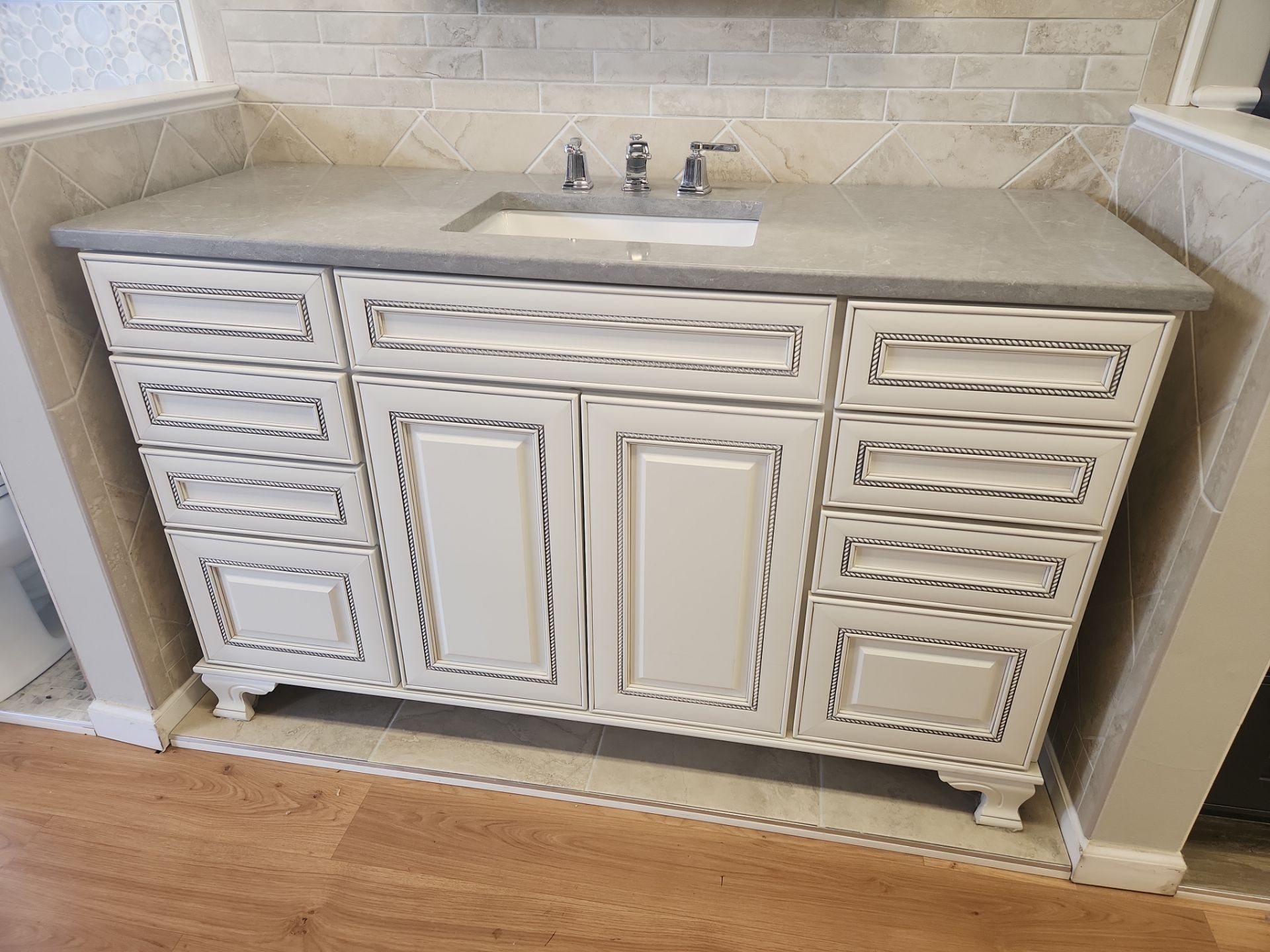 Luxury furniture-grade bathroom vanity suite in light cream by Mid Continent