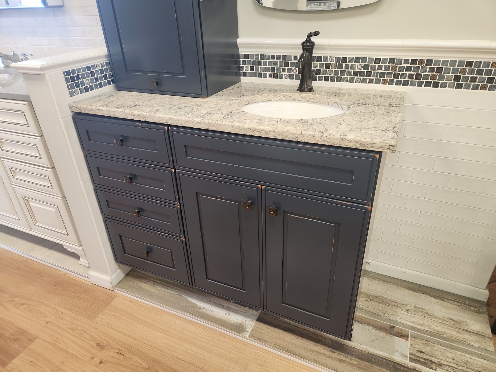 Luxury furniture-grade bathroom vanity suite in deep navy with side storage
