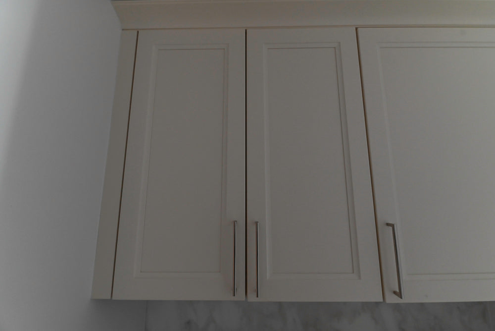 kitchen cabinets with a neutral background