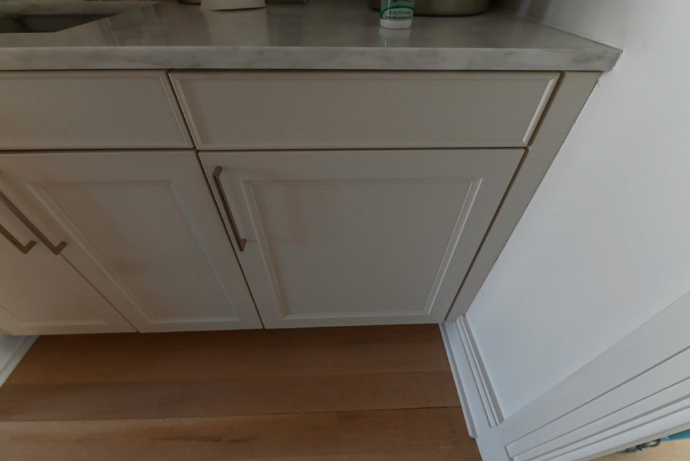 Gray kitchen cabinets with a neutral color scheme