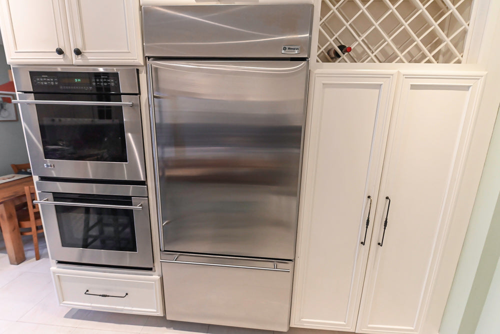 Candelight Traditional Off White Kitchen with Island and Monogram Appliances
