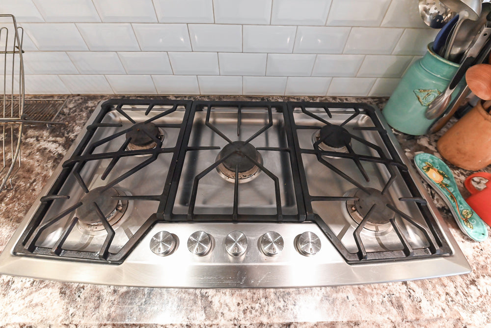 Candelight Traditional Off White Kitchen with Island and Monogram Appliances