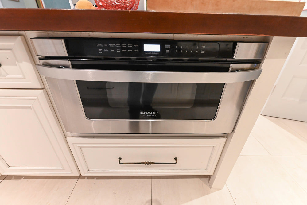 Candelight Traditional Off White Kitchen with Island and Monogram Appliances