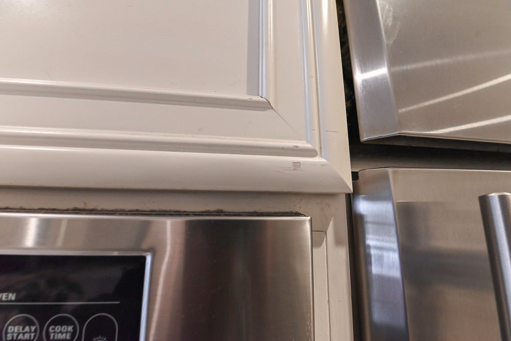 Candelight Traditional Off White Kitchen with Island and Monogram Appliances