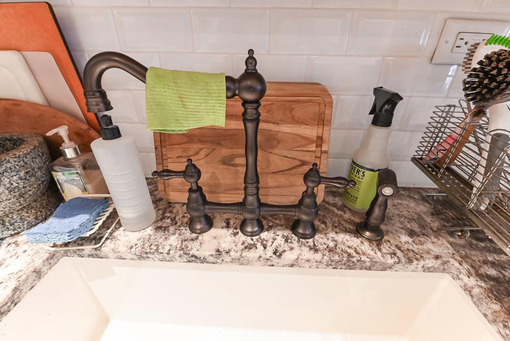 Candelight Traditional Off White Kitchen with Island and Monogram Appliances