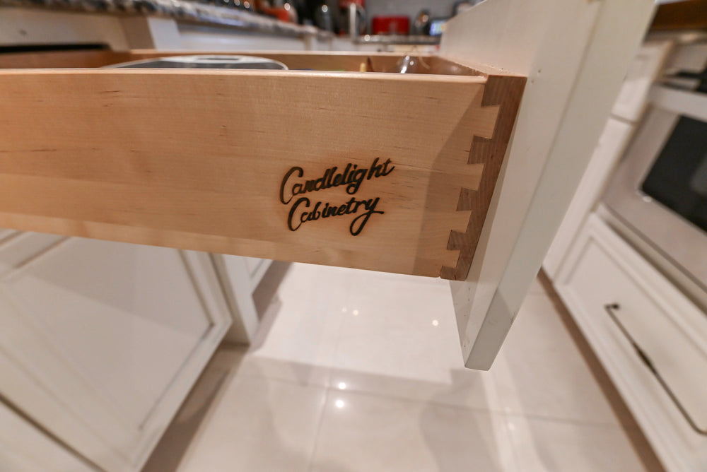 Candelight Traditional Off White Kitchen with Island and Monogram Appliances