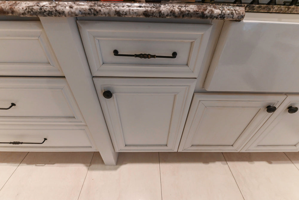 Candelight Traditional Off White Kitchen with Island and Monogram Appliances