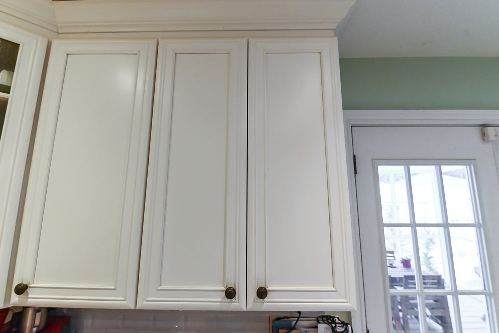 Candelight Traditional Off White Kitchen with Island and Monogram Appliances