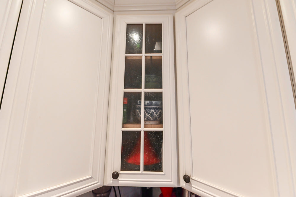 Candelight Traditional Off White Kitchen with Island and Monogram Appliances